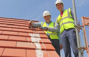 Alan Read left and Paul LeGrice top out the showhome at Hares Green in Watton sm