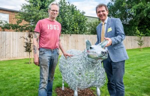Tony Abel of Abel Homes right and Nigel Barnett of Fransham Forge with the new sheep sculpture in Watton 500px