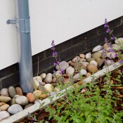 Abel Homes Downpipe and Pebble Edging Detail
