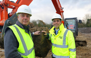 Abel Homes production manager Robert Loudoun left and managing director Paul LeGrice cut the first sod at Gressenhall sm