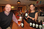 Marcus Sanders of Abel Homes and Marta Sztorc of the White Hart in Hingham toast the success of The Hops Bitter