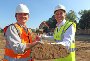 Paul Legrice (right) and Luke Matthews of Abel Homes cut the first sod at the site of 17 new homes in East Harling 500px