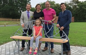 Phil and Bonnie Royle and their daughter Grace unveil the new bench watched by Tony Abel left and James Spedding right sm