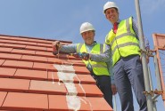 Alan Read left and Paul LeGrice top out the showhome at Hares Green in Watton sm