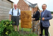 Artist Carl Preston left with Maggie and Tony Abel of Abel Homes at the unveiling in Gressenhall 500px