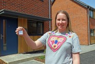 Catherine Smith with the keys to her new home at Rokeles Green in Watton sm