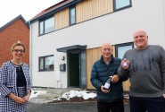 Darren Mckenna right and his father Thomas receive the keys to Mr Mckennas new home from Abel Homes sales manager Clare Cornish sm