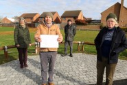 Maggie Abel left and artists from Holkham Forge at the site of a new bench in Bawdeswell sm