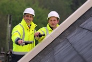 Paul LeGrice left and Alan Hawkins from Abel Homes top out the first of the new homes at Gressenhall sm