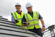 Paul LeGrice left and Danny Pinner top out the first new home at Abel Homes Bluebell Rise site in Bawdeswell sm