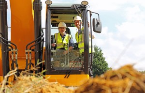 Little Melton Parish Council chair John Heaser cuts the first sod helped by Paul LeGrice of Abel Homes sm2