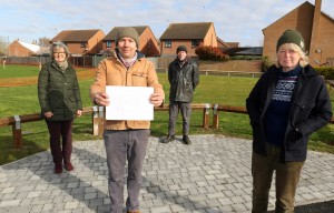 Maggie Abel left and artists from Holkham Forge at the site of a new bench in Bawdeswell sm