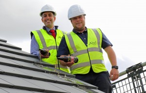 Paul LeGrice left and Danny Pinner top out the first new home at Abel Homes Bluebell Rise site in Bawdeswell sm