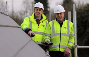 Paul Legrice left and Alan Read of Abel Homes perform the traditional topping out ceremony at Little Melton sm