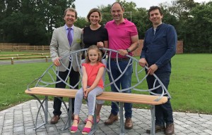 Phil and Bonnie Royle and their daughter Grace unveil the new bench watched by Tony Abel left and James Spedding right sm